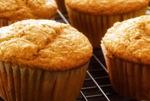 A fresh batch of Banana Bran muffins cooling on a rack.